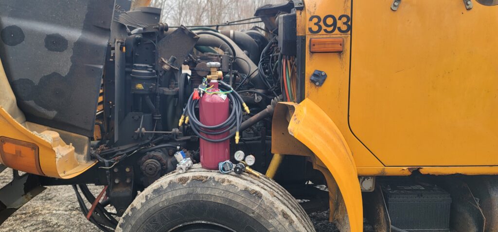 JTM RDS installed on yellow commercial truck engine