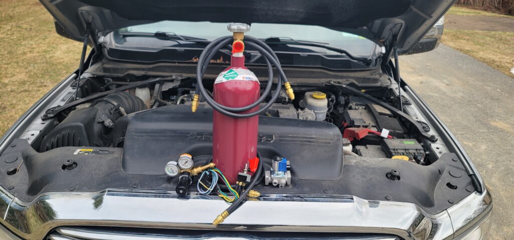 JTM Runaway Diesel Suppressor installed under hood of RAM truck