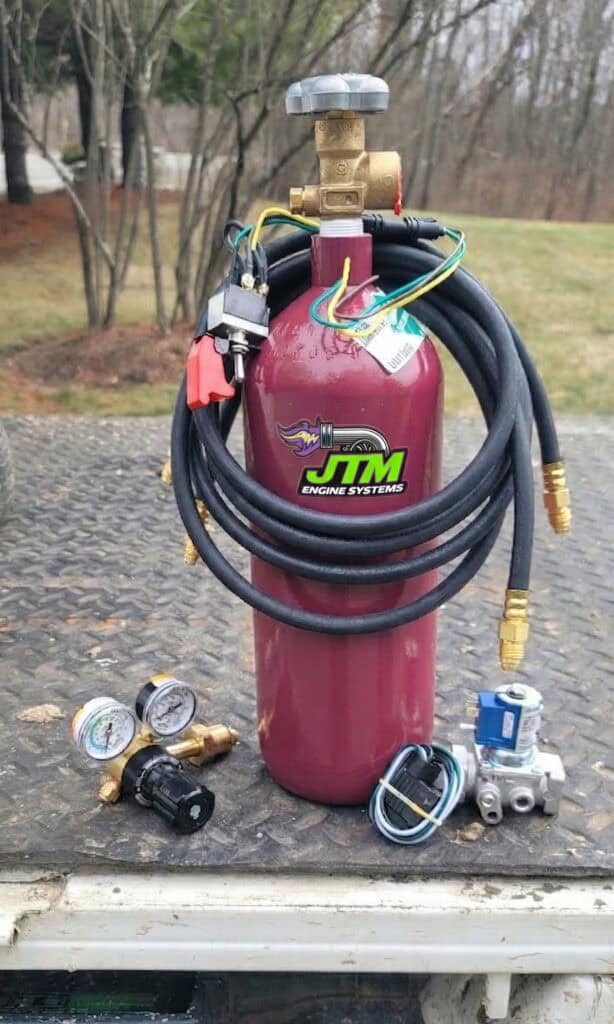 JTM Runaway Diesel Suppressor system — argonite tank, braided lines, gauges, solenoid, and activation switch